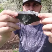 Taras Kul holding a flint rock