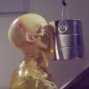 Dummy getting a paint can to the face.