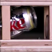 Coke can being destroyed by a ping pong ball cannon