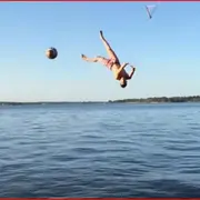 Man catching a ball mid-air